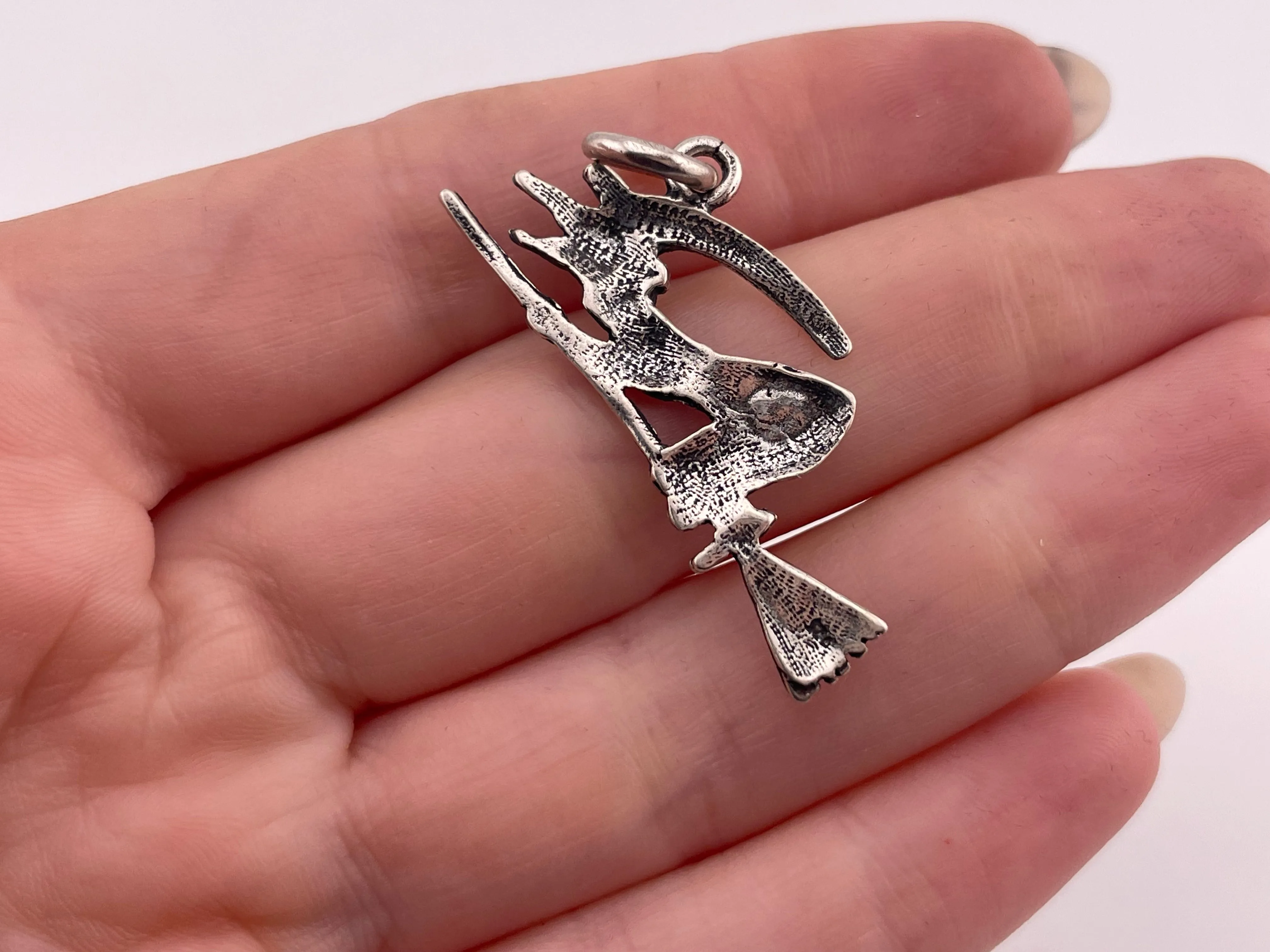 sterling silver witch riding broomstick pendant