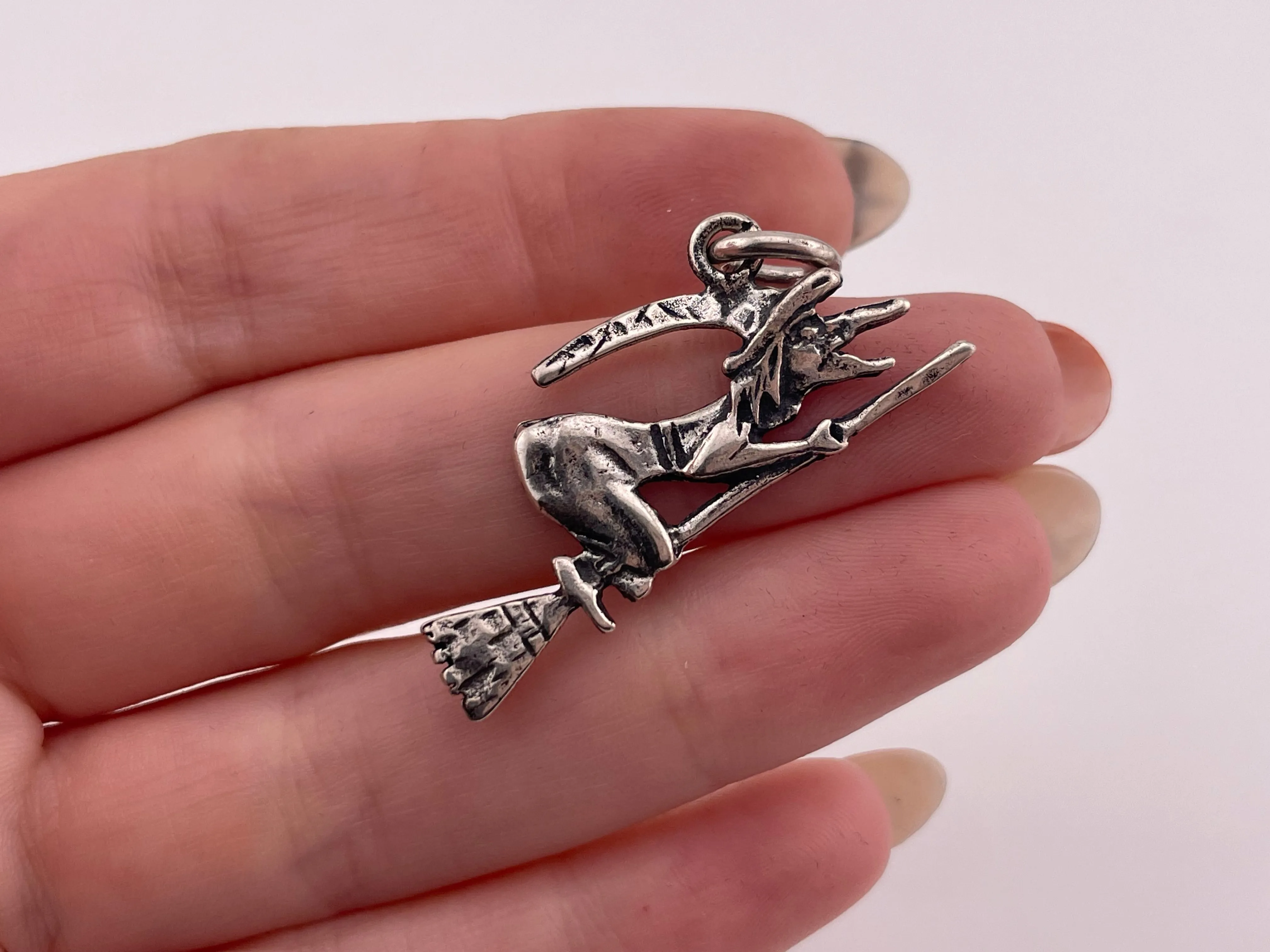 sterling silver witch riding broomstick pendant